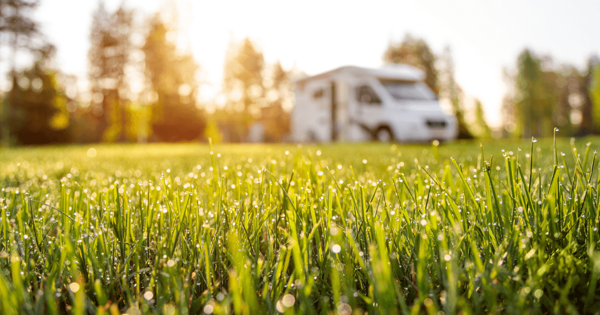 An RV parked at a nearby campground with the slide extended on a quiet morning, ready for a spring shakedown trip