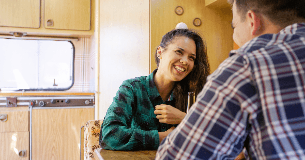 A used travel trailer parked at a private seller's home, ready for inspection